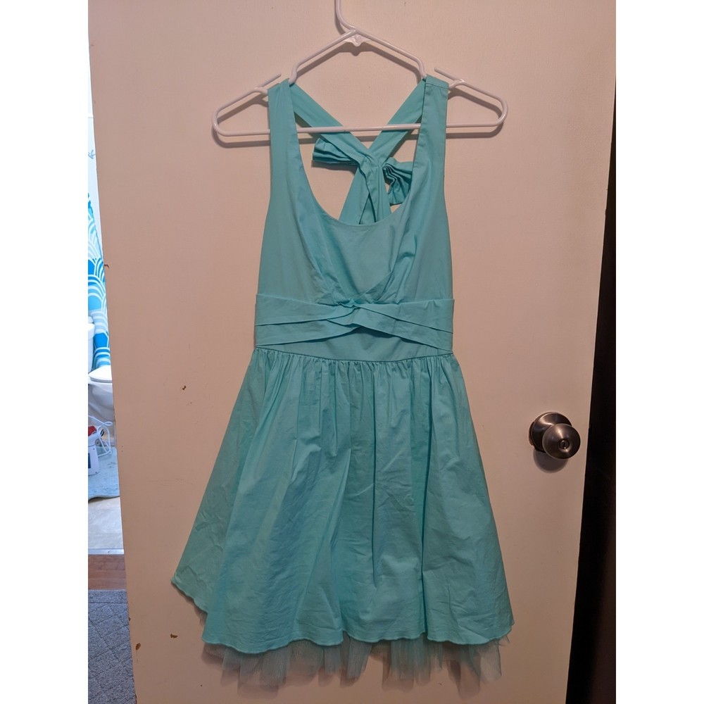 Turquoise cross back dress with bow and flounce